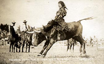 [ woman riding bucking bull ]